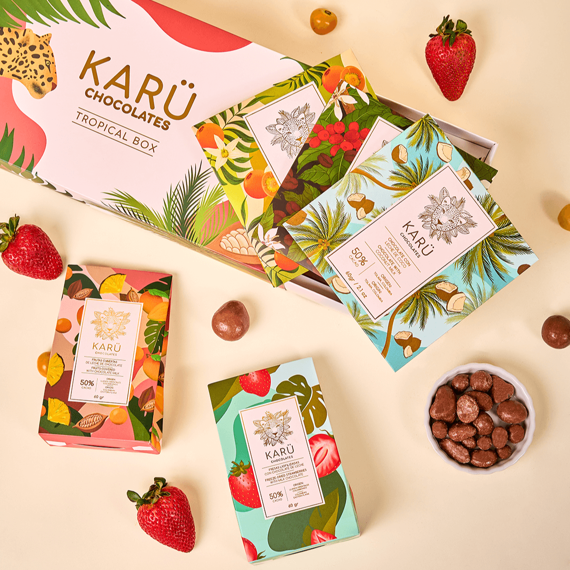 Tropical Box Kit with white chocolate with lulo, 70% dark chocolate with coffee, coconut milk chocolate, tropical fruits covered in milk chocolate, and strawberries covered in milk chocolate.