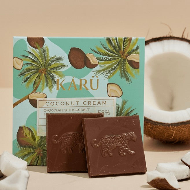 Karu coconut cream chocolate bars with packaging and a coconut in the background