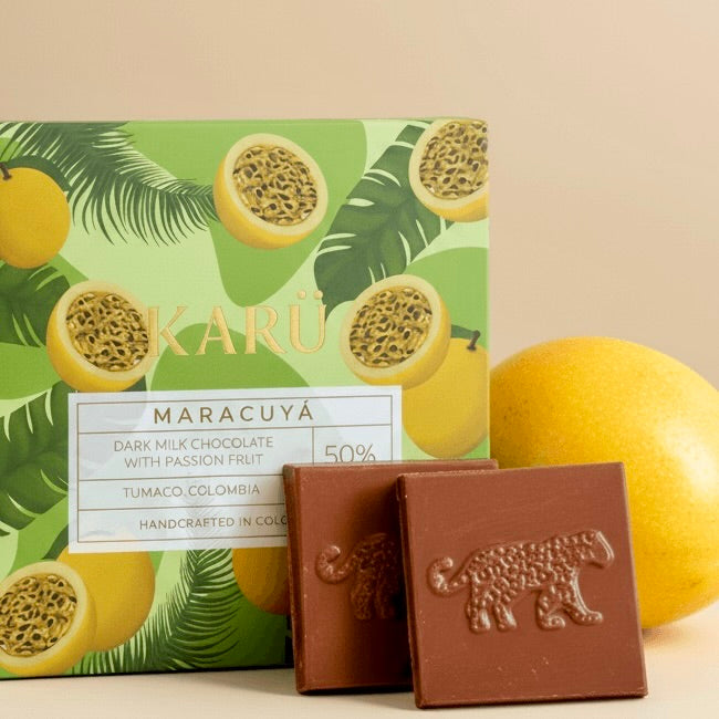 Karu Maracuya chocolate bars with passion fruit packaging on a beige background